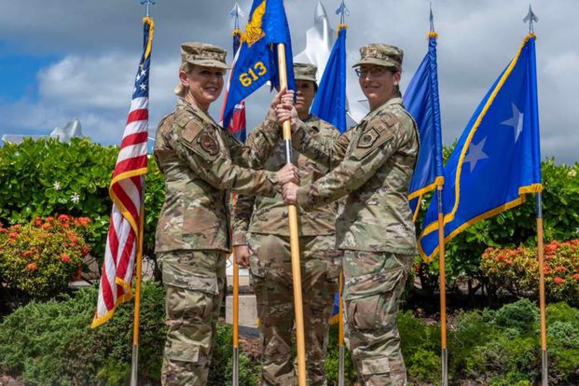 Col. Julie Sposito-Salceies (right), incoming commander of the 613th Air Operations Center, receives the guidon in a ceremony on Joint Base Pearl Harbor-Hickam, Hawaii, June 26, 2024. Sposito-Salceies was relieved of command in January 2025. (U.S. Air Force photo by Senior Airman Mark Sulaica)