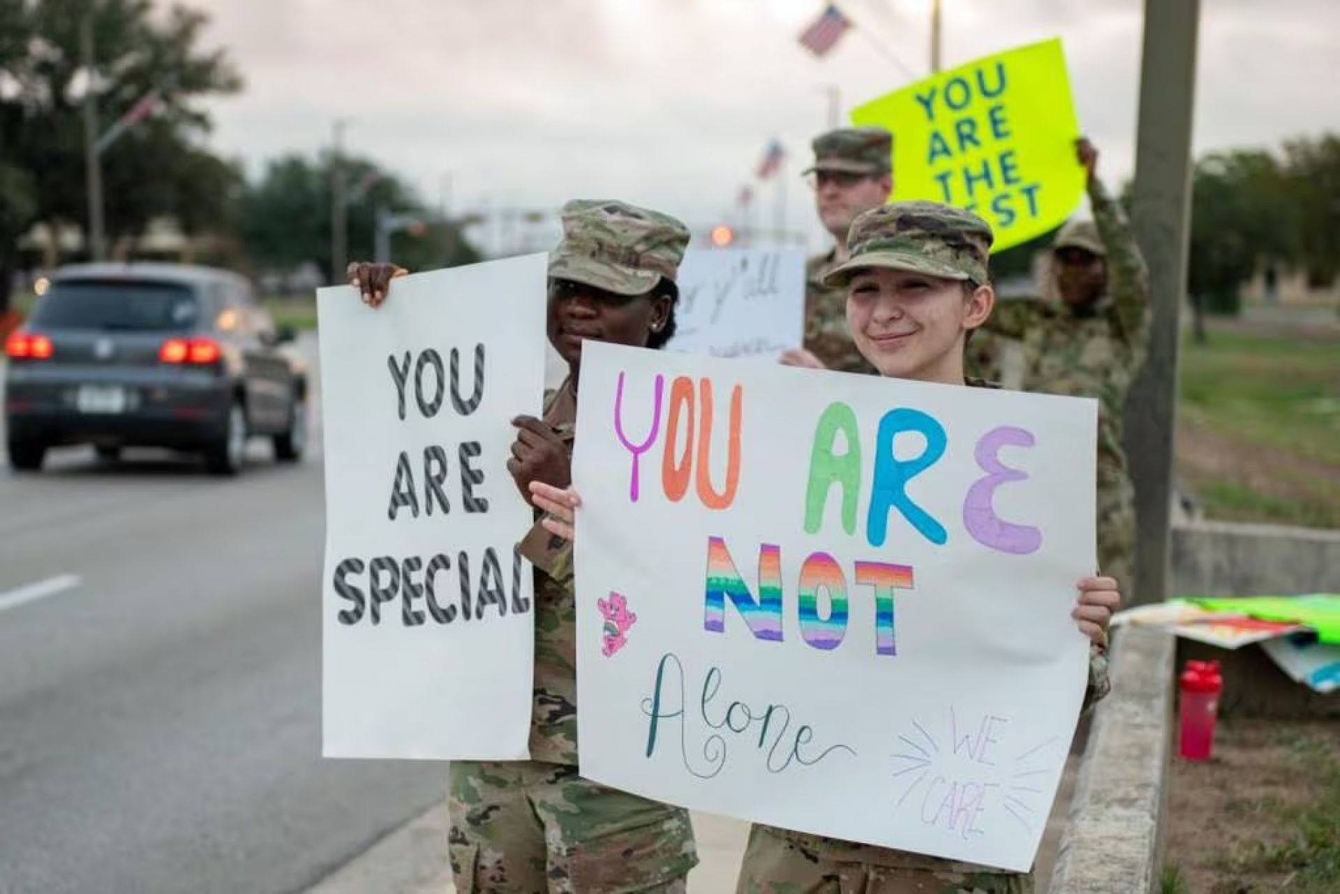 Airmen with the 502nd Comptroller Squadron hold suicide prevention messages outside of Joint Base San Antonio-Lackand on Sept. 16, 2022. (Thomas Coney/Air Force)