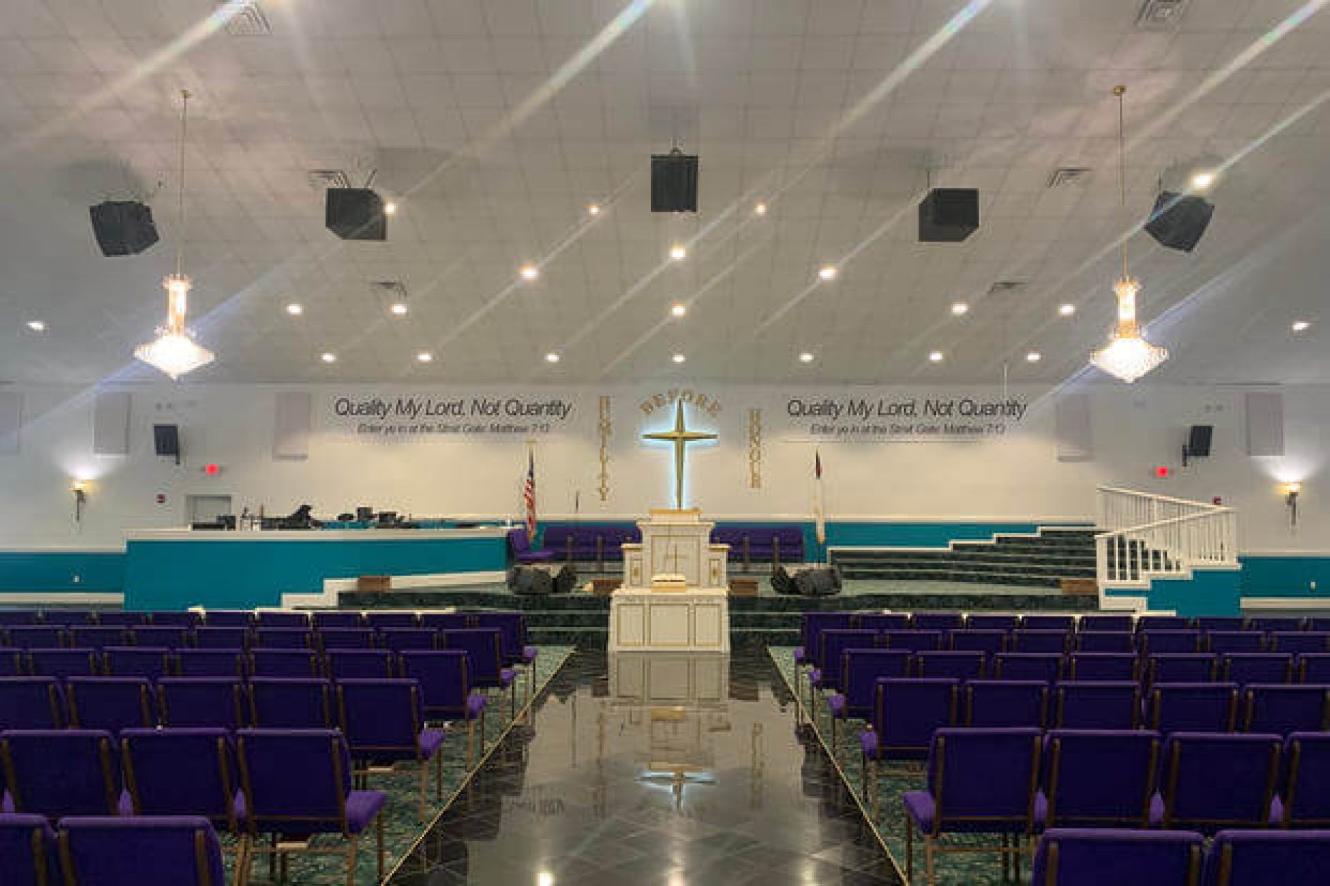 The altar of the main church for the House of Prayer in Hinesville, Georgia, features a large cross and a reference to a verse from the gospel of Matthew. (Military.com photo by Thomas Novelly)